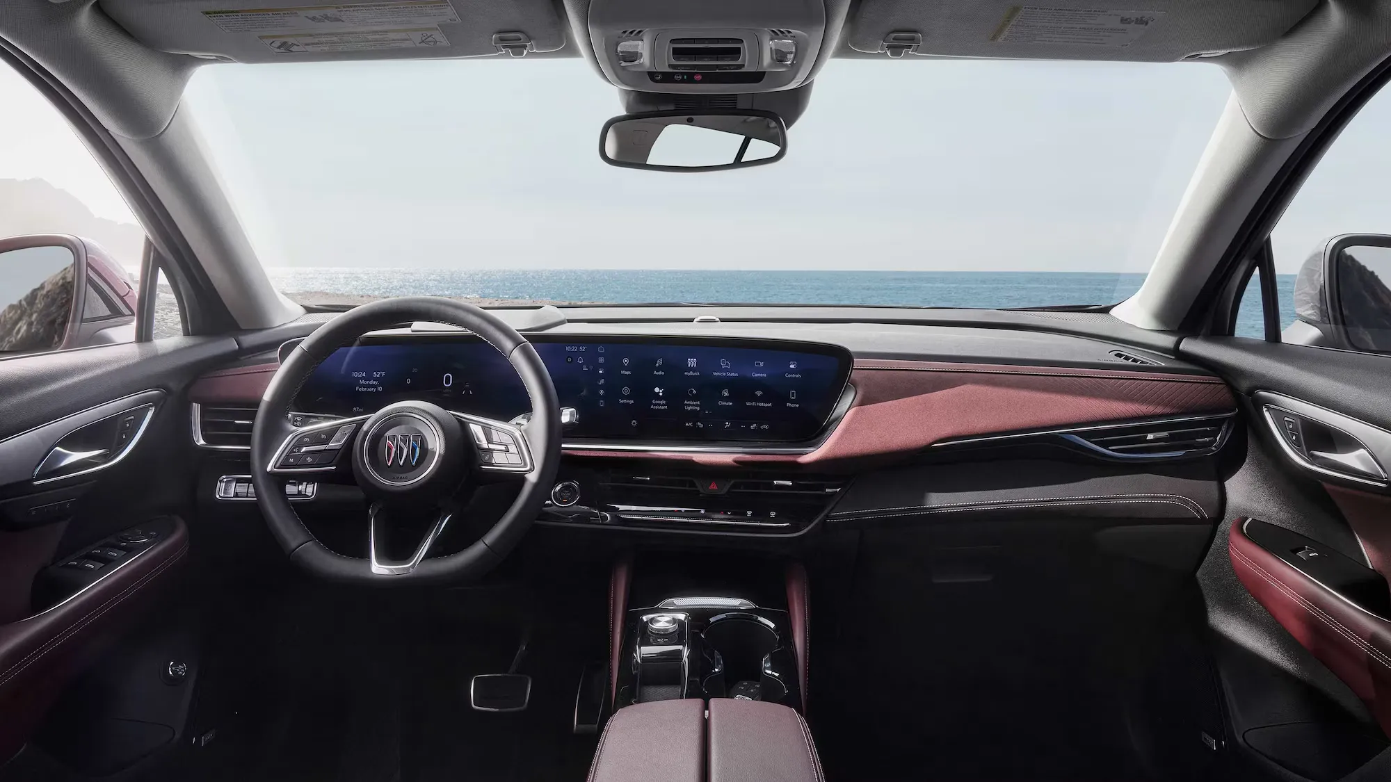 Habitacle du Buick Envision 2026 vu depuis les sièges arrière vers le tableau de bord.