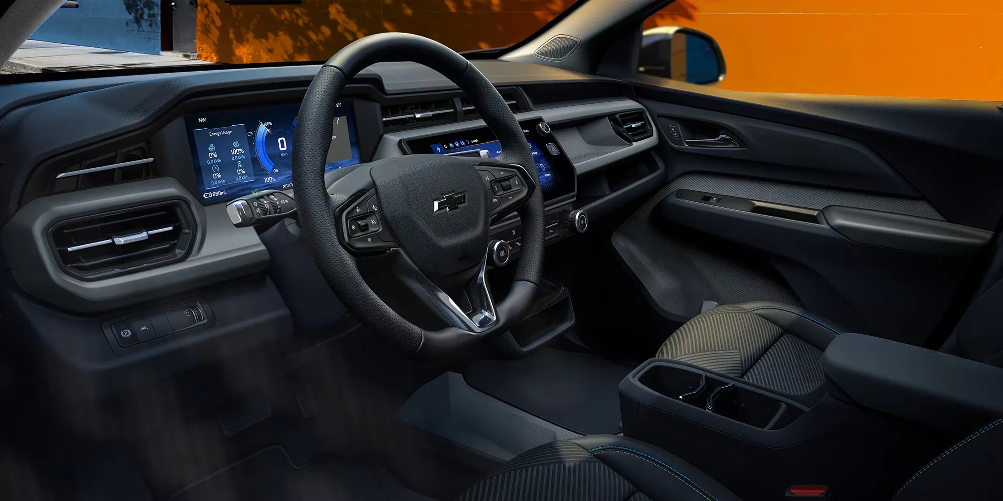 Habitacle du Chevrolet Bolt 2027 avec tableau de bord numérique et écran central.